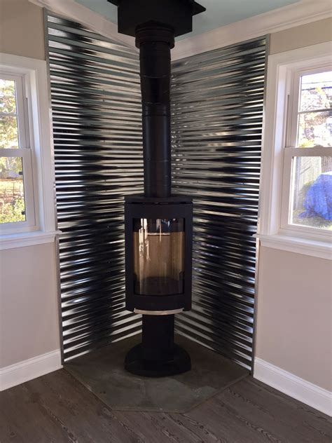 sheet metal wood stove|metal behind wood stove.